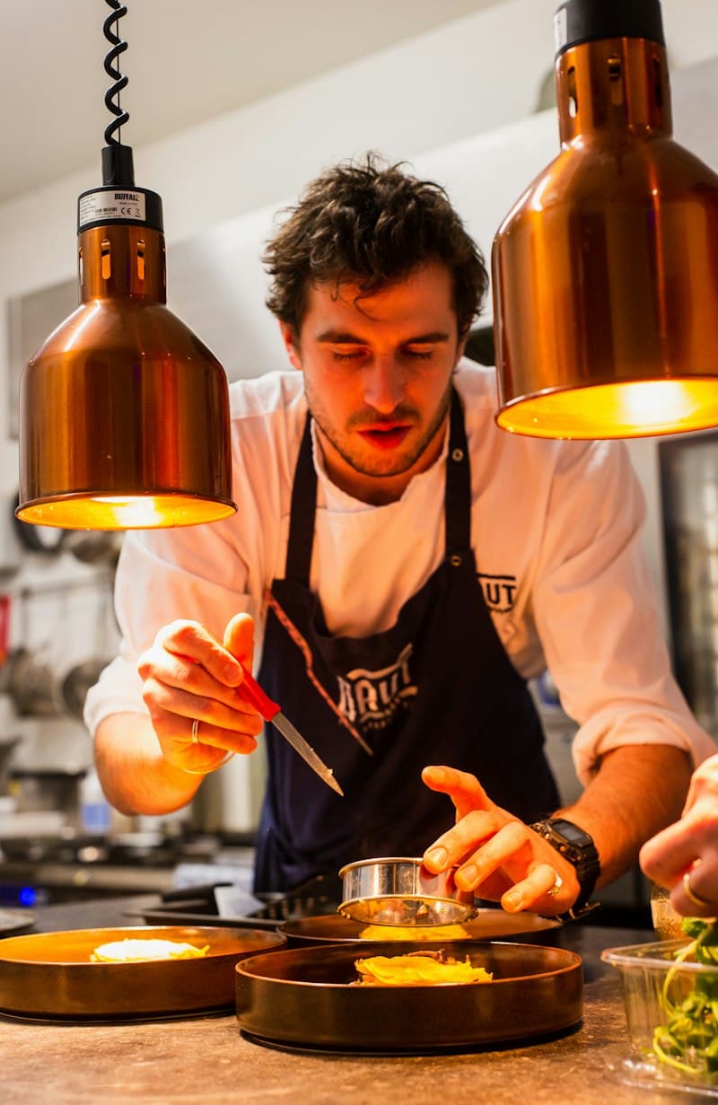 Chef crafting culinary dishes with delicate steam infusion